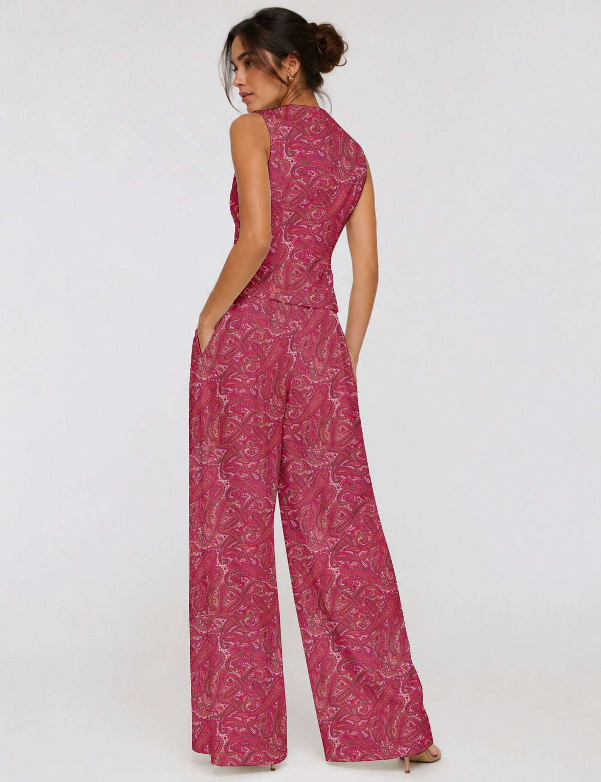 Women's tailored waistcoat set with a sleeveless V-neck button-front waistcoat and high-rise wide leg trousers in a coordinated matching outfit.
