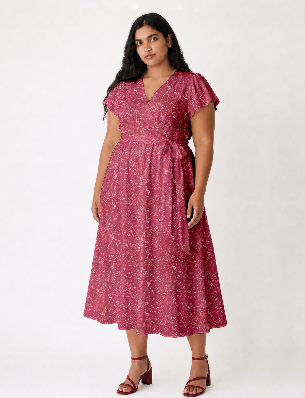 Elegant midi wrap dress with a V-neckline, adjustable waist tie, fitted bodice, and flared skirt for a timeless, flattering silhouette.