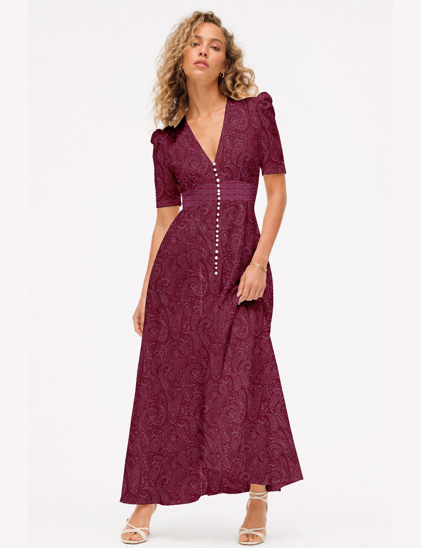 Maxi romantic dress with a fitted bodice, V-neckline, functional button placket, structured waist panel, short sleeves, and a softly flared ankle-length A-line skirt.