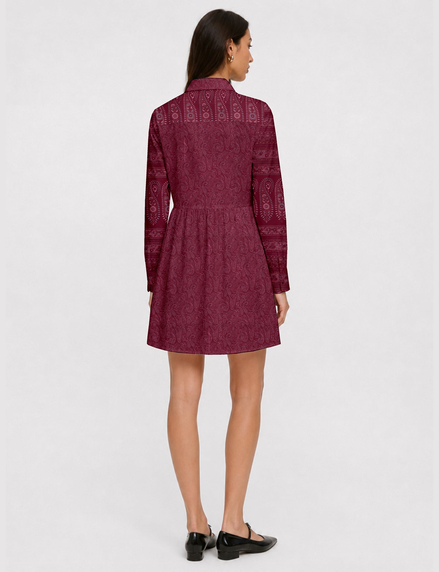 Short shirt dress with a relaxed A-line silhouette, point collar, partial button placket, gathered waist, side pockets, and full-length cuffed sleeves.