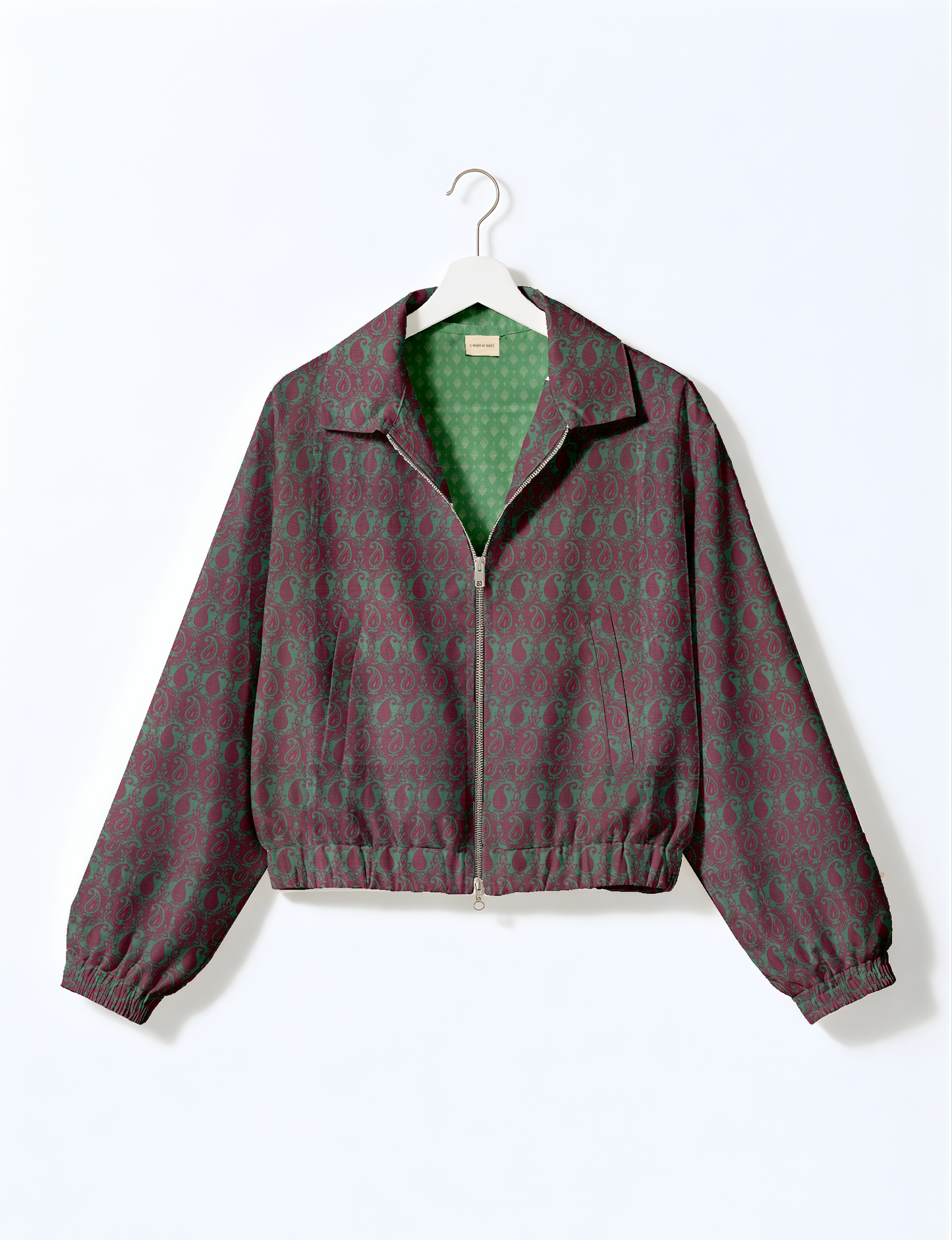 Upcycled Bomber Jacket made from recycled sari materials, featuring a cute cropped shape, elasticated hem and cuffs, and contrast sari print lining. Sustainable apparel promoting eco-friendly fashion and ethical clothing.