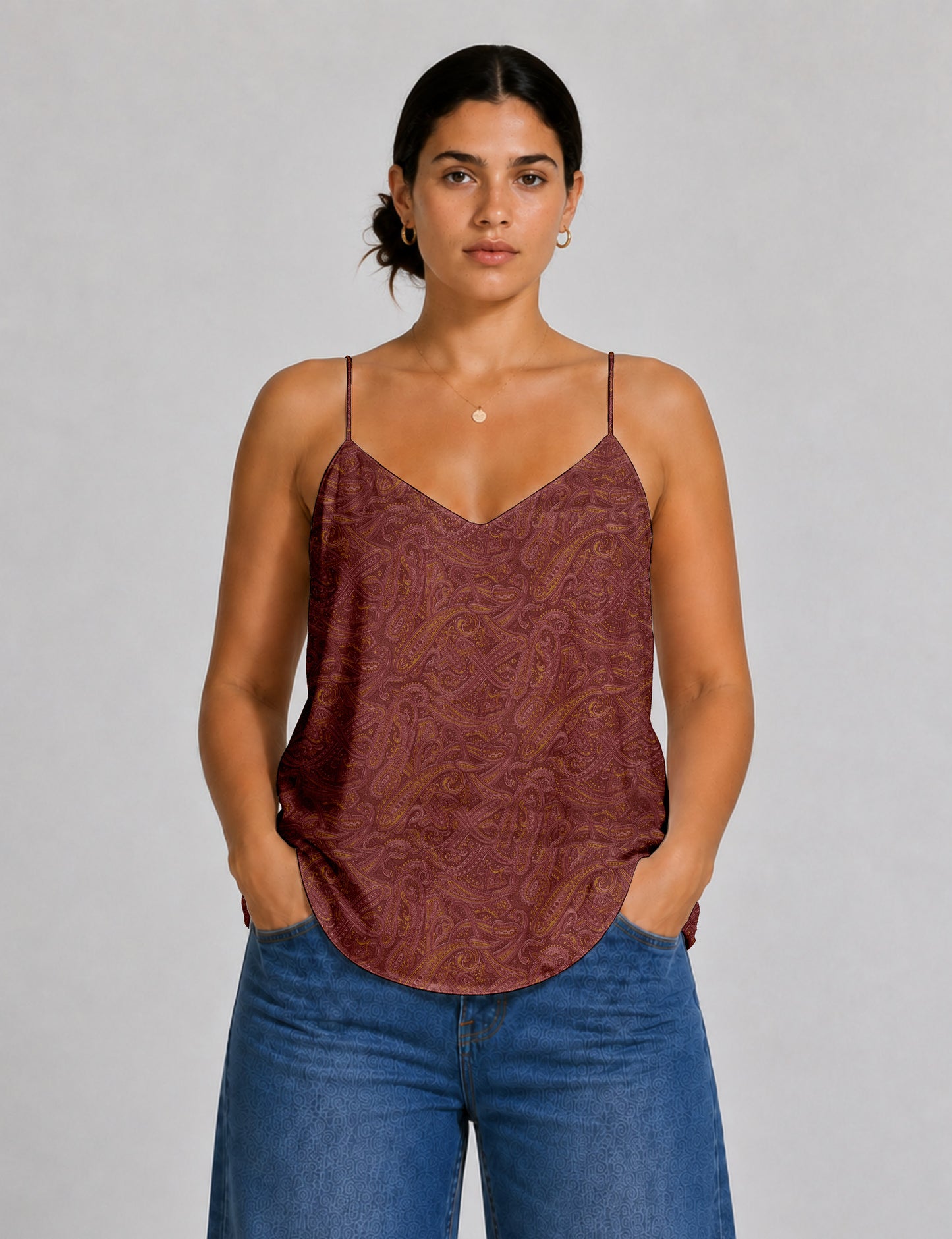 Women's sleeveless slip top with a relaxed straight fit, soft V-neckline, deep V-back, and delicate spaghetti straps.