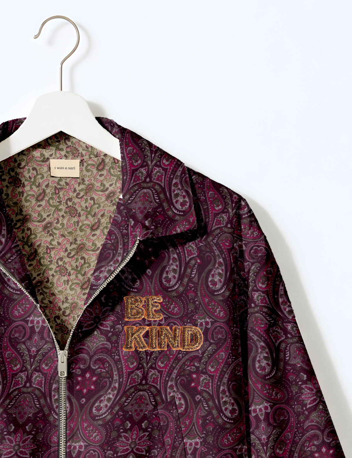 BE KIND Bomber jacket made from upcycled sari fabric with handcrafted Aari embroidery by female artisans.