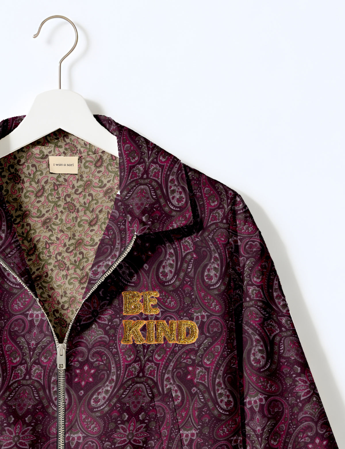 BE KIND Bomber jacket made from upcycled sari fabric with handcrafted Aari embroidery by female artisans.