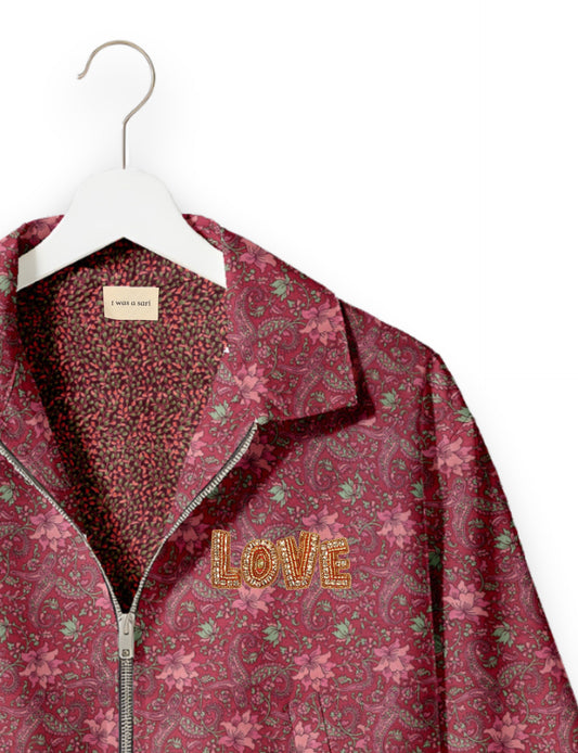 Love Bomber Jacket made from recycled fabric, featuring hand-stitched Aari embroidery. A unique piece of zero-waste clothing, part of the circular fashion movement. Designed with upcycled materials for a stylish yet environmentally friendly clothing choice.