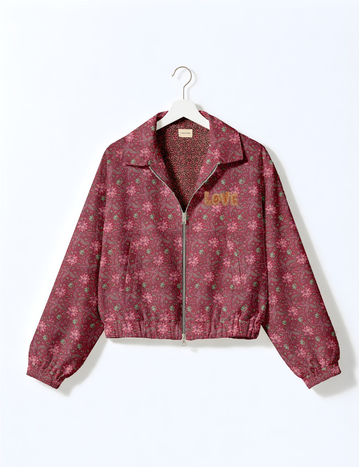 Love Bomber Jacket made from recycled fabric, featuring hand-stitched Aari embroidery. A unique piece of zero-waste clothing, part of the circular fashion movement. Designed with upcycled materials for a stylish yet environmentally friendly clothing choice.