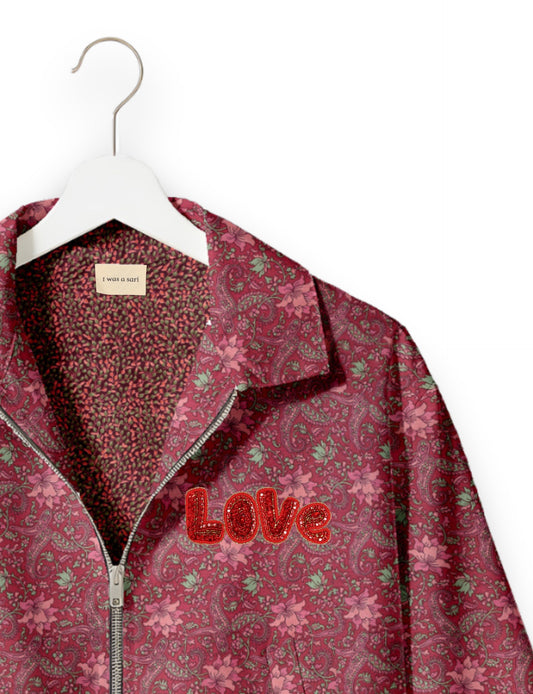 Love Bomber Jacket made from recycled fabric, featuring hand-stitched Aari embroidery. A unique piece of zero-waste clothing, part of the circular fashion movement. Designed with upcycled materials for a stylish yet environmentally friendly clothing choice.