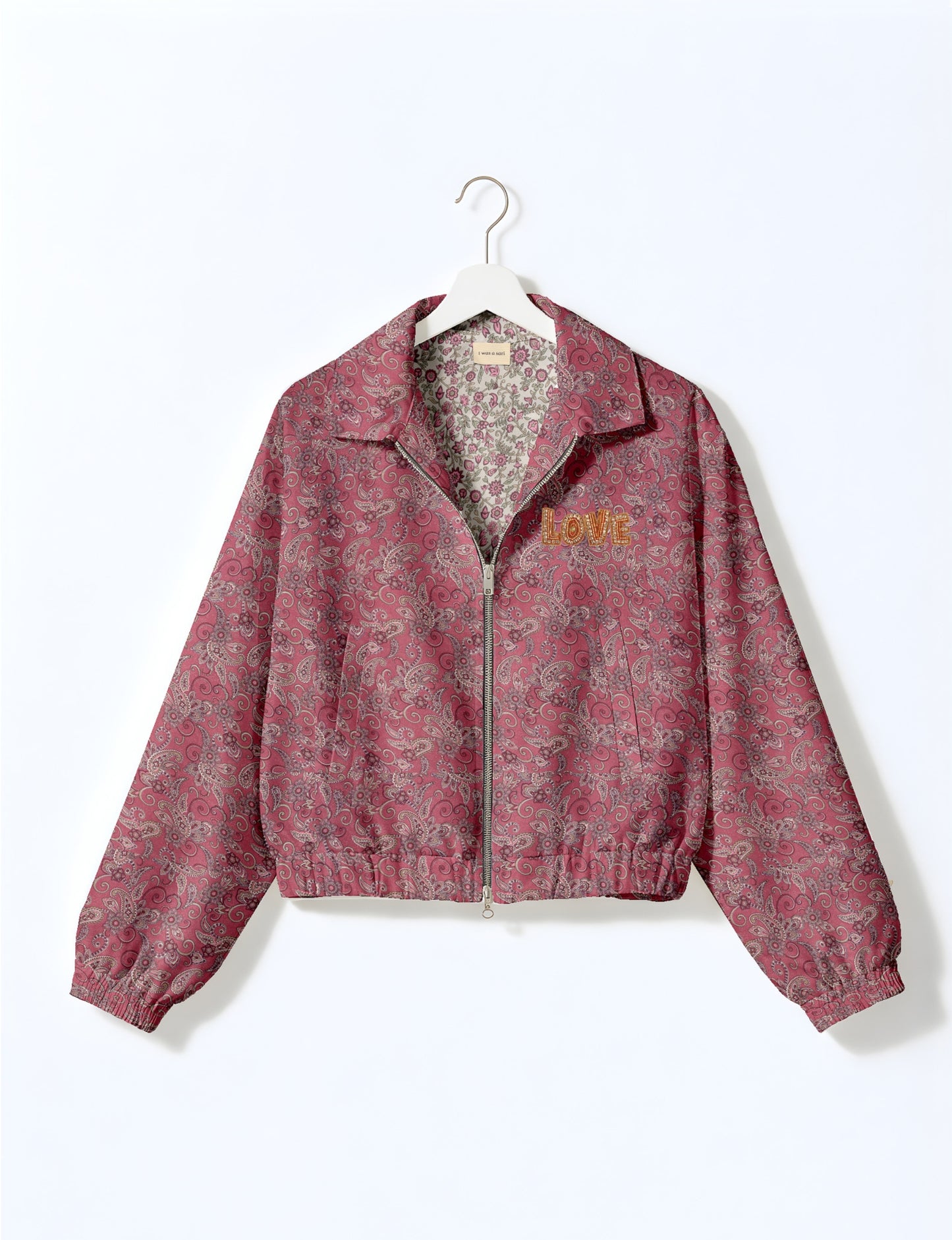 Love Bomber Jacket made from recycled fabric, featuring hand-stitched Aari embroidery. A unique piece of zero-waste clothing, part of the circular fashion movement. Designed with upcycled materials for a stylish yet environmentally friendly clothing choice.