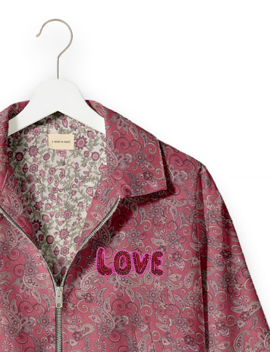 Love Bomber Jacket made from recycled fabric, featuring hand-stitched Aari embroidery. A unique piece of zero-waste clothing, part of the circular fashion movement. Designed with upcycled materials for a stylish yet environmentally friendly clothing choice.