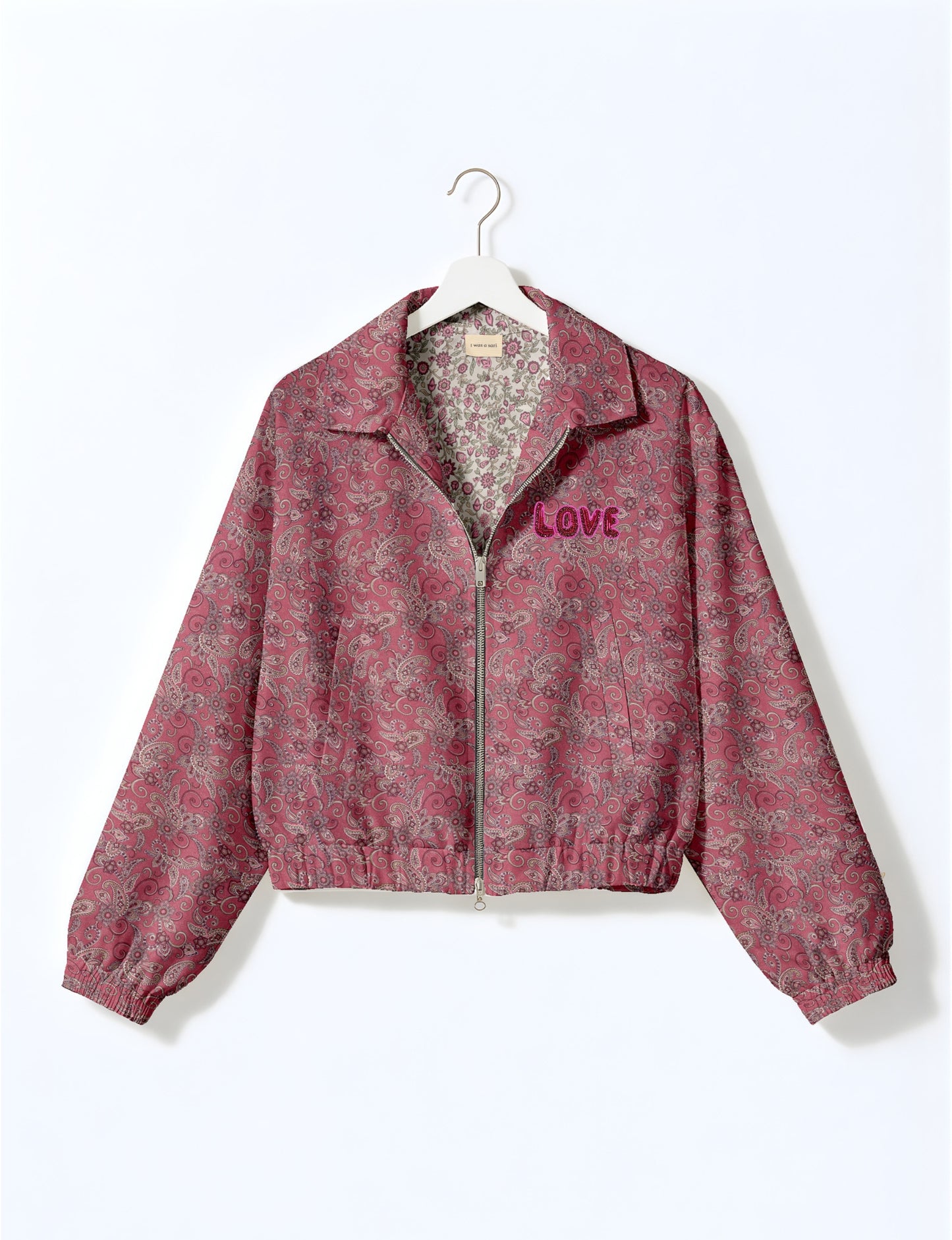 Love Bomber Jacket made from recycled fabric, featuring hand-stitched Aari embroidery. A unique piece of zero-waste clothing, part of the circular fashion movement. Designed with upcycled materials for a stylish yet environmentally friendly clothing choice.