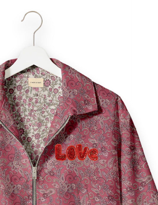 Love Bomber Jacket made from recycled fabric, featuring hand-stitched Aari embroidery. A unique piece of zero-waste clothing, part of the circular fashion movement. Designed with upcycled materials for a stylish yet environmentally friendly clothing choice.