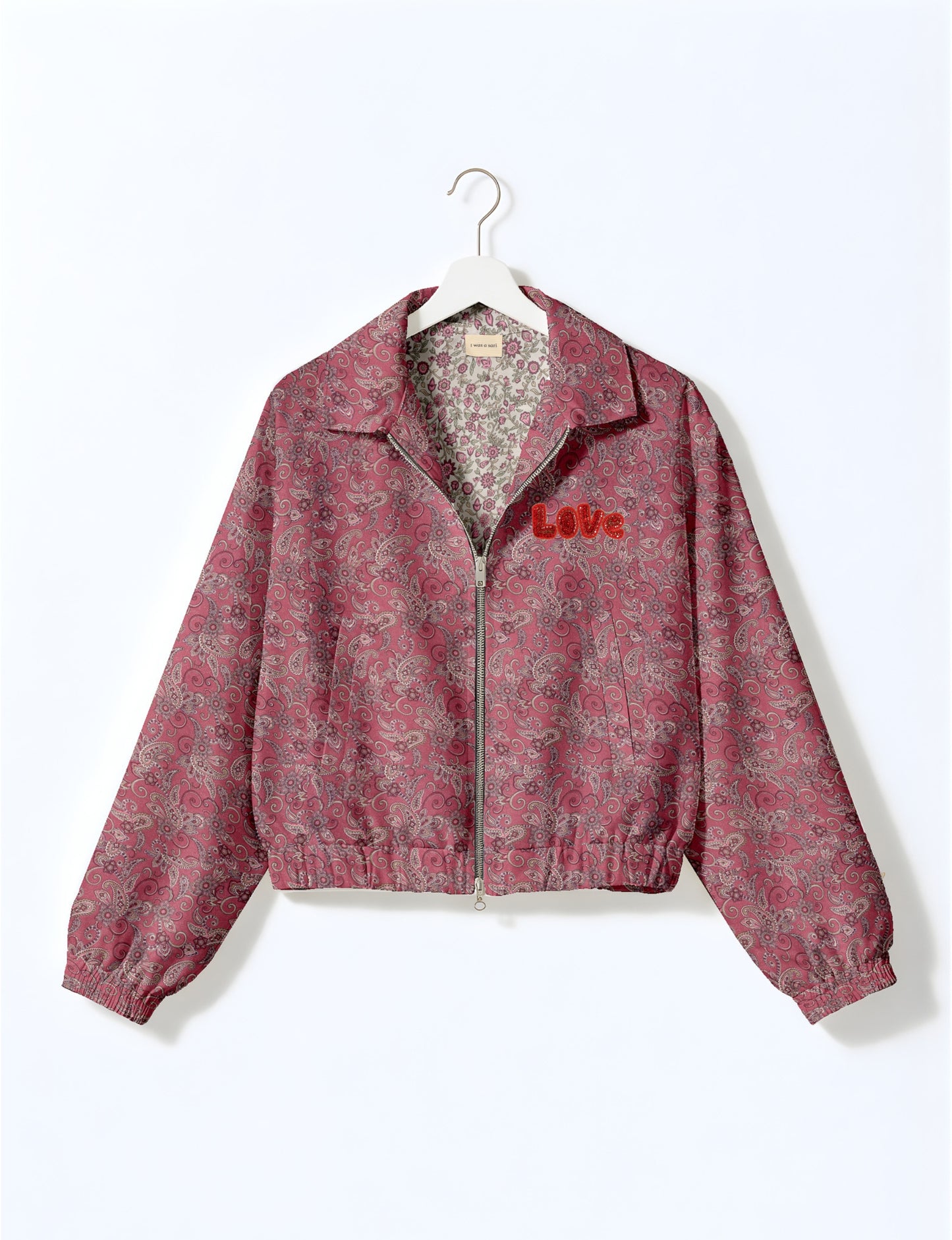 Love Bomber Jacket made from recycled fabric, featuring hand-stitched Aari embroidery. A unique piece of zero-waste clothing, part of the circular fashion movement. Designed with upcycled materials for a stylish yet environmentally friendly clothing choice.