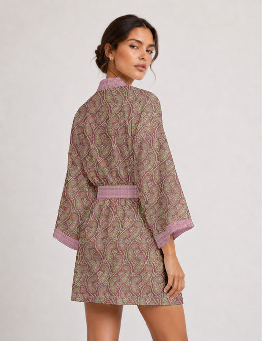 Short kimono robe with wrap front, V-neckline, wide sleeves, waist tie, and concealed skort detail.