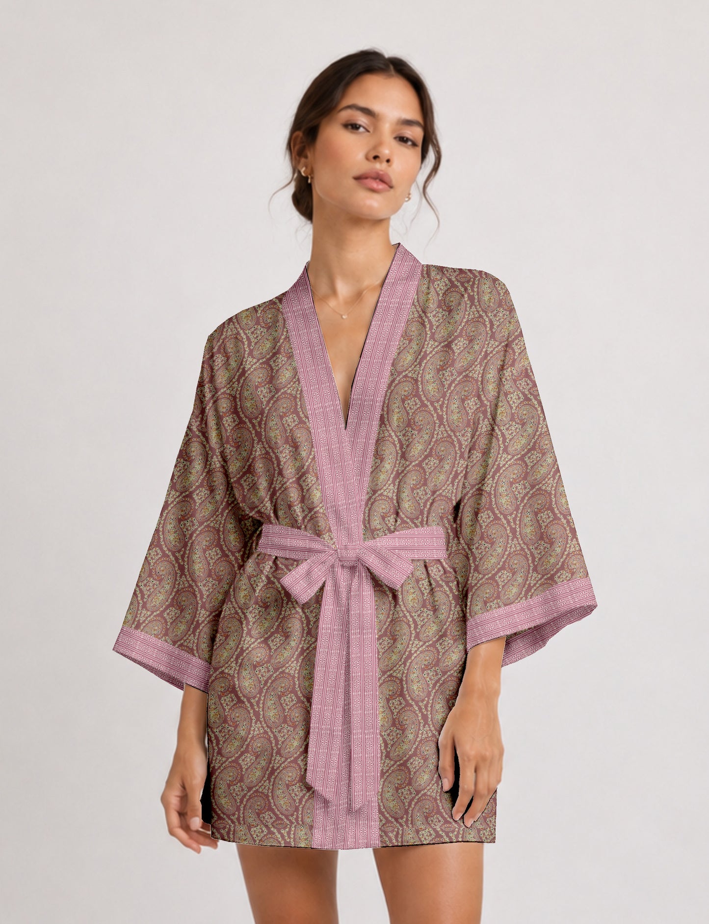 Short kimono robe with wrap front, V-neckline, wide sleeves, waist tie, and concealed skort detail.