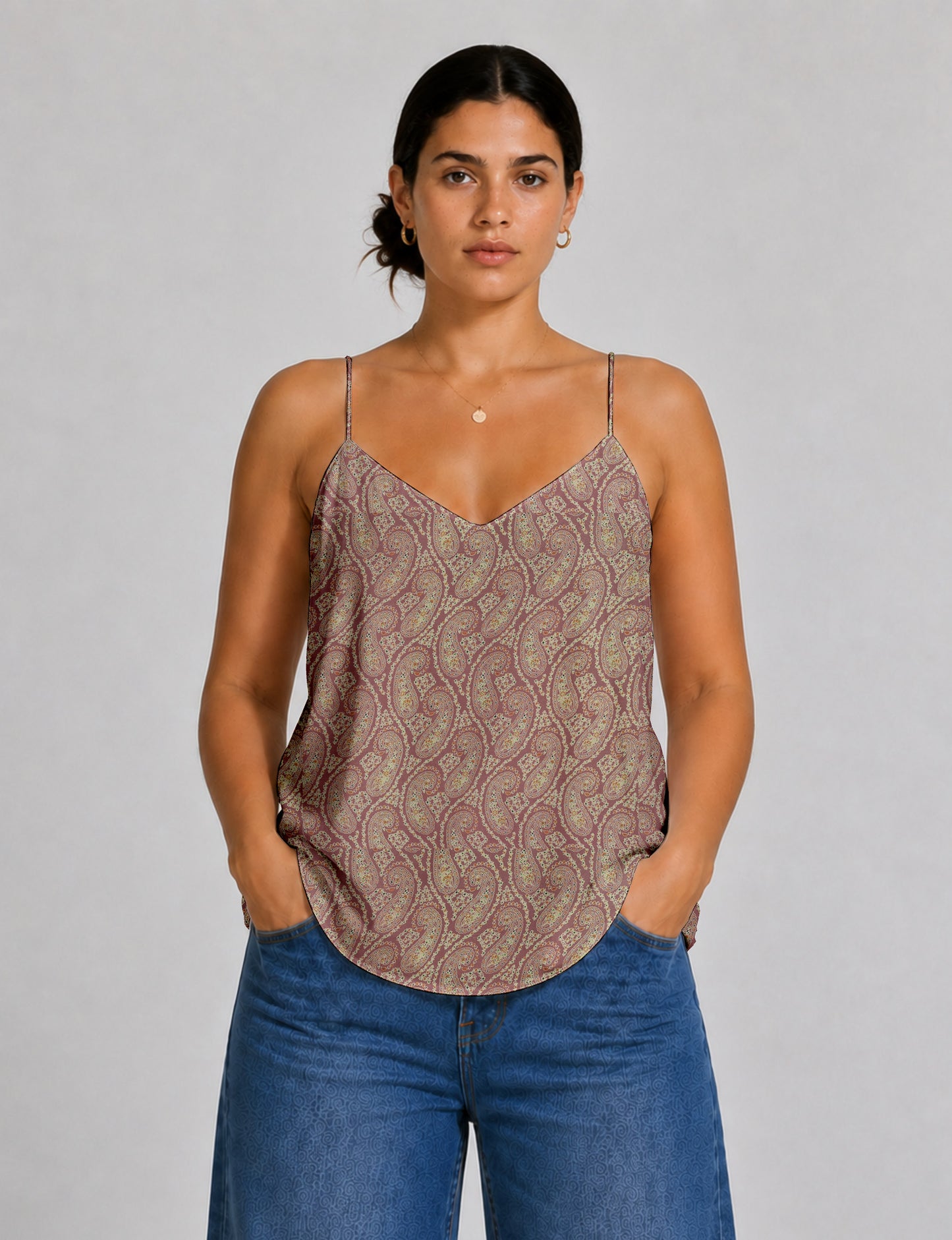 Women's sleeveless slip top with a relaxed straight fit, soft V-neckline, deep V-back, and delicate spaghetti straps.