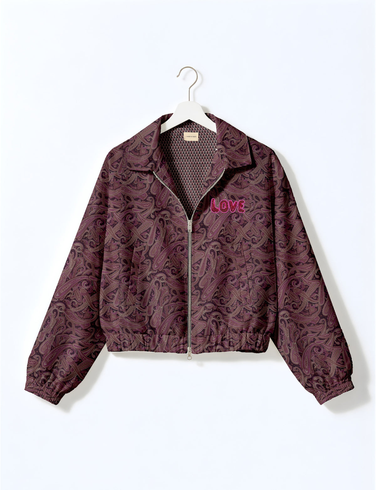 Love Bomber Jacket made from recycled fabric, featuring hand-stitched Aari embroidery. A unique piece of zero-waste clothing, part of the circular fashion movement. Designed with upcycled materials for a stylish yet environmentally friendly clothing choice.