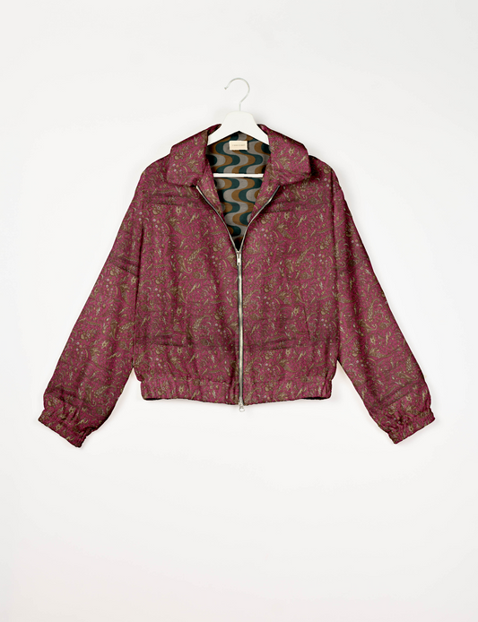 Upcycled Bomber Jacket made from recycled sari materials, featuring a cute cropped shape, elasticated hem and cuffs, and contrast sari print lining. Sustainable apparel promoting eco-friendly fashion and ethical clothing.