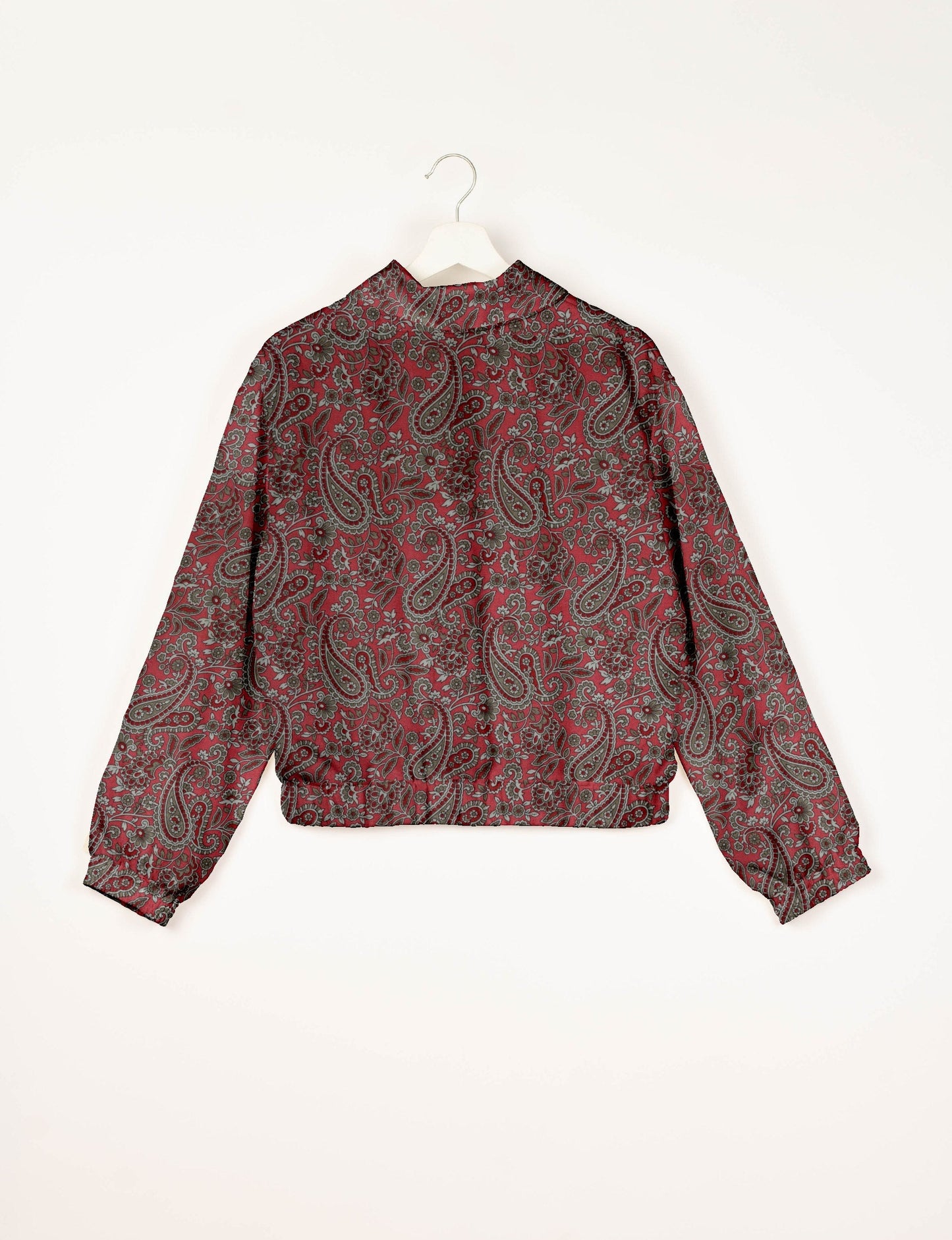 Upcycled Bomber Jacket made from recycled sari materials, featuring a cute cropped shape, elasticated hem and cuffs, and contrast sari print lining. Sustainable apparel promoting eco-friendly fashion and ethical clothing.