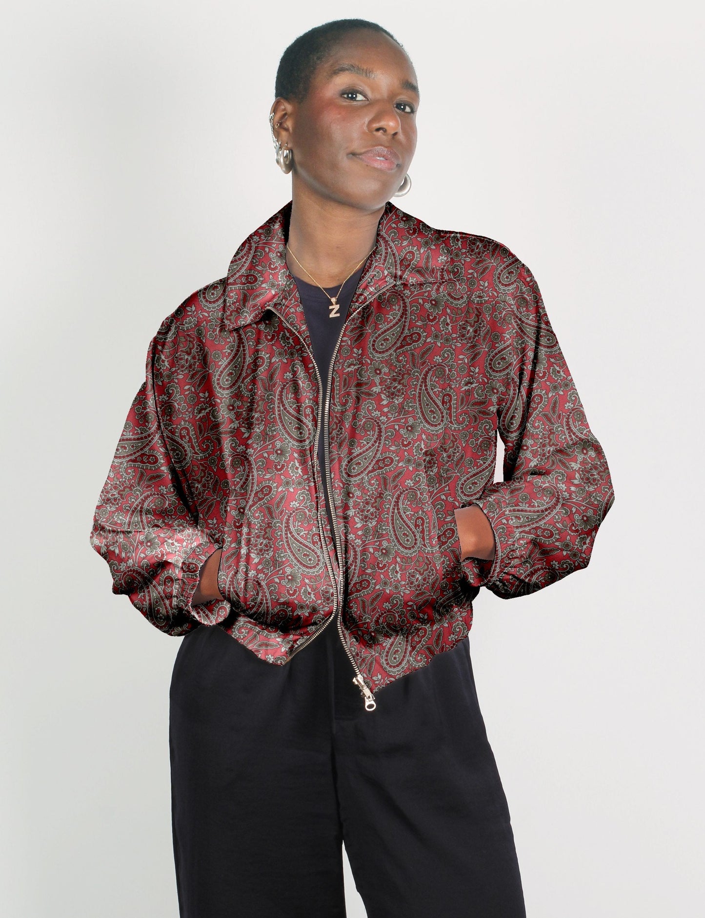 Upcycled Bomber Jacket made from recycled sari materials, featuring a cute cropped shape, elasticated hem and cuffs, and contrast sari print lining. Sustainable apparel promoting eco-friendly fashion and ethical clothing.