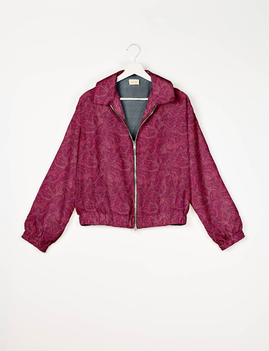 Upcycled Bomber Jacket made from recycled sari materials, featuring a cute cropped shape, elasticated hem and cuffs, and contrast sari print lining. Sustainable apparel promoting eco-friendly fashion and ethical clothing.