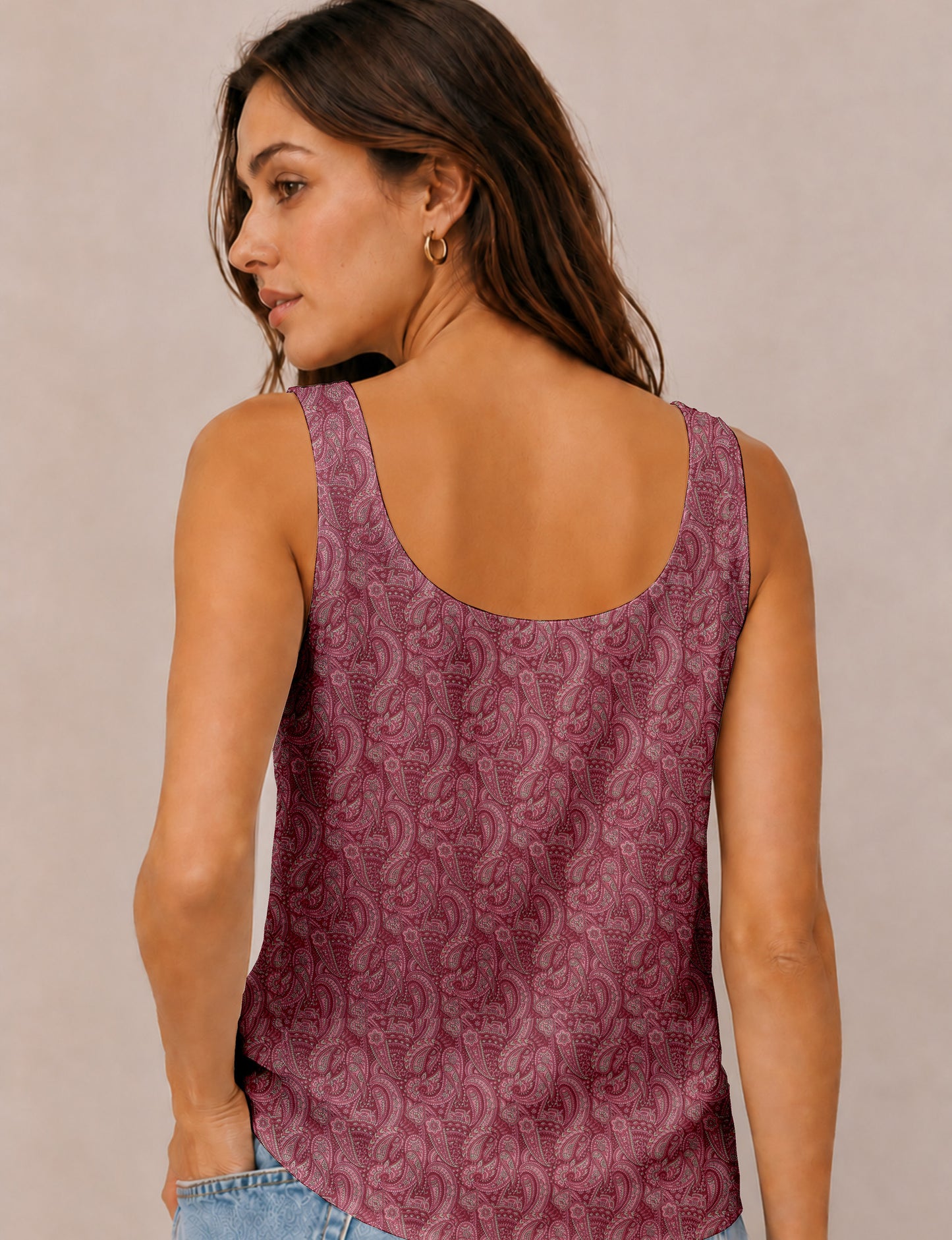 Women's sleeveless blouse with a relaxed straight fit, wide scoop neckline, deep scoop back, and hip-length silhouette.