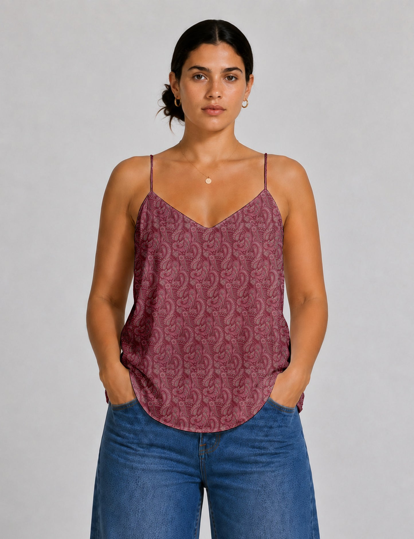 Women's sleeveless slip top with a relaxed straight fit, soft V-neckline, deep V-back, and delicate spaghetti straps.