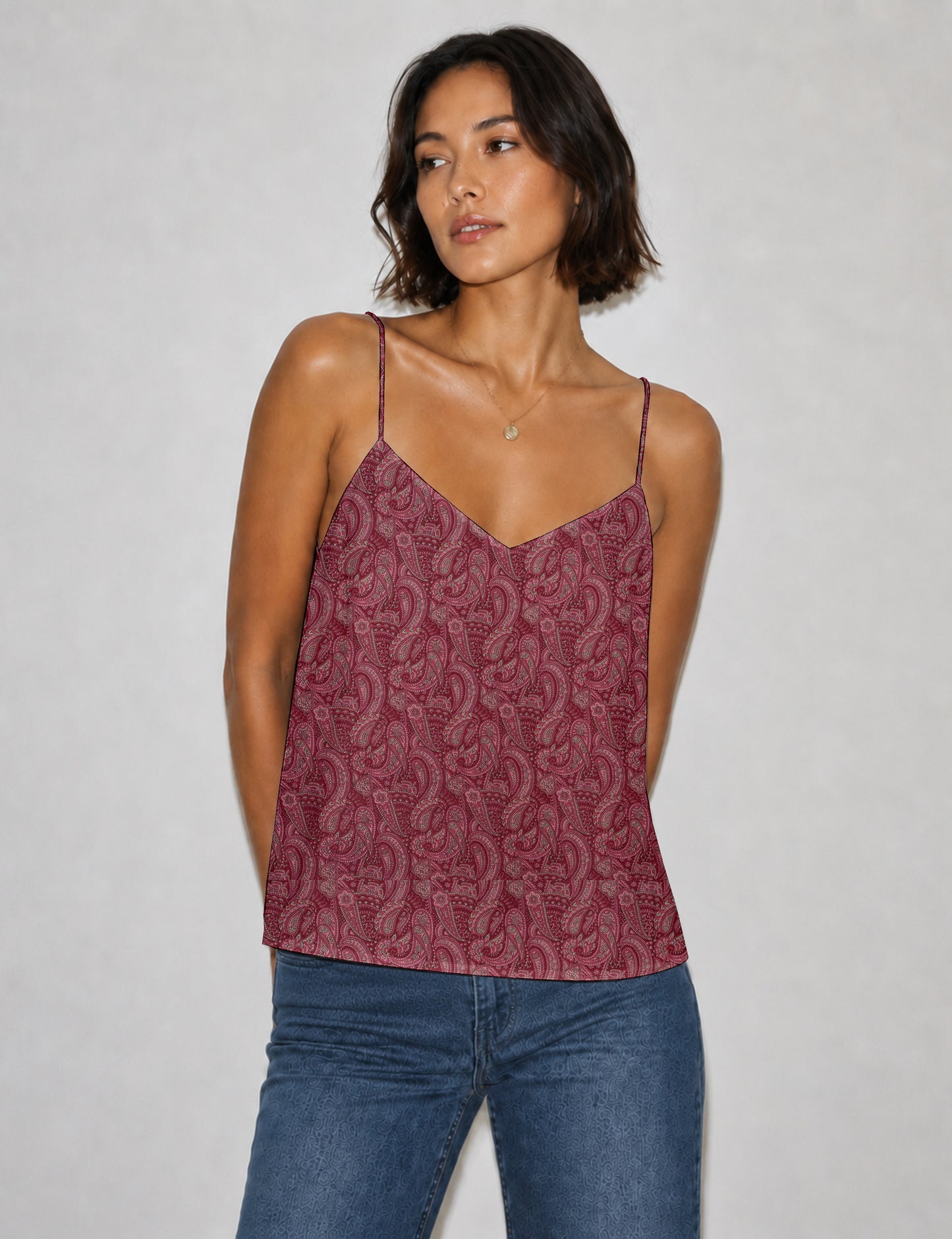 Women's sleeveless slip top with a relaxed straight fit, soft V-neckline, deep V-back, and delicate spaghetti straps.