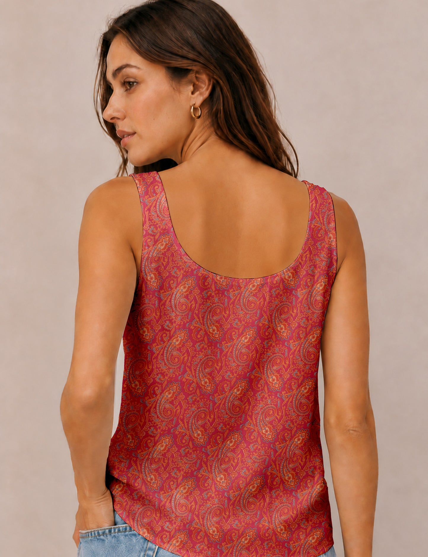 Women's sleeveless blouse with a relaxed straight fit, wide scoop neckline, deep scoop back, and hip-length silhouette.