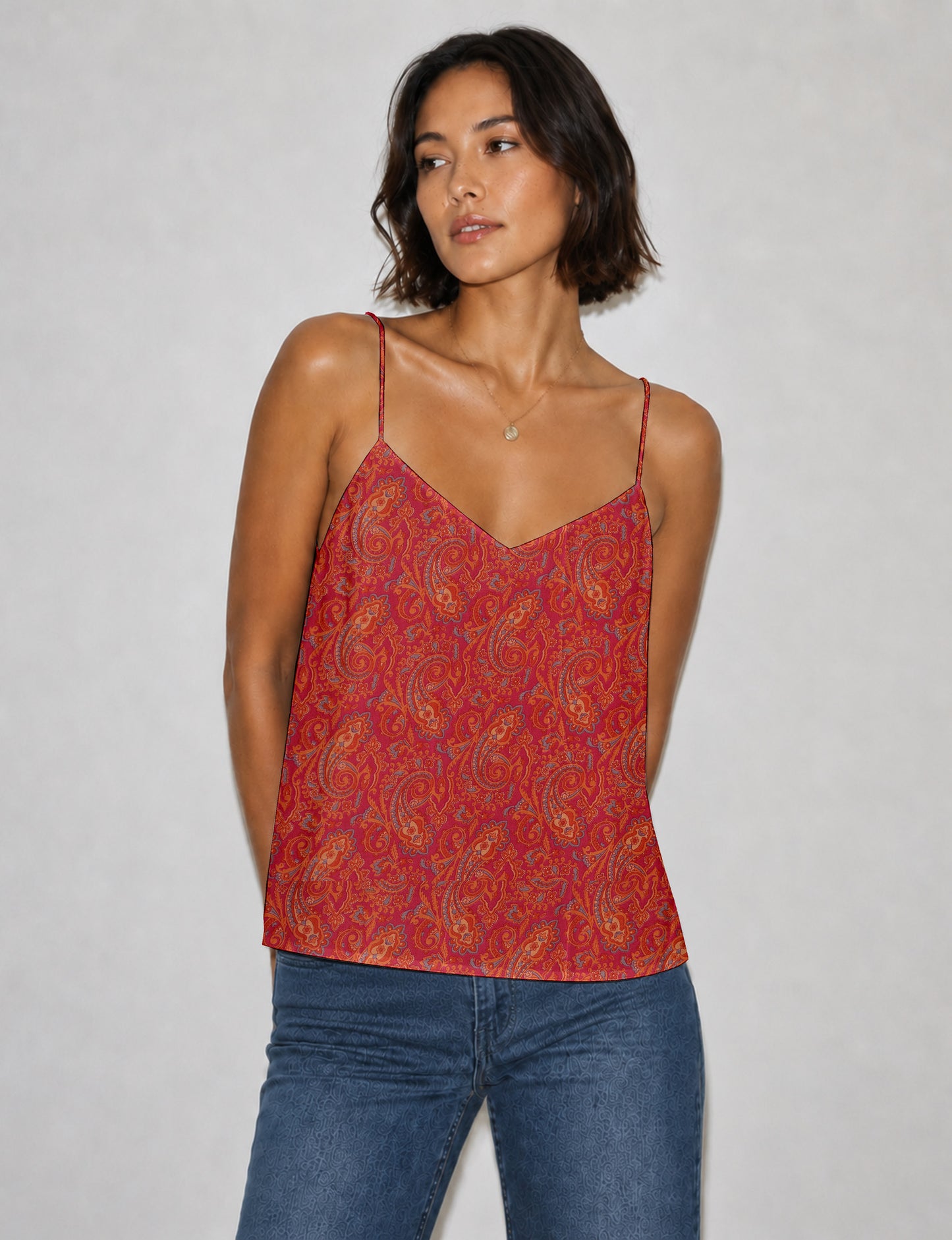 Women's sleeveless slip top with a relaxed straight fit, soft V-neckline, deep V-back, and delicate spaghetti straps.