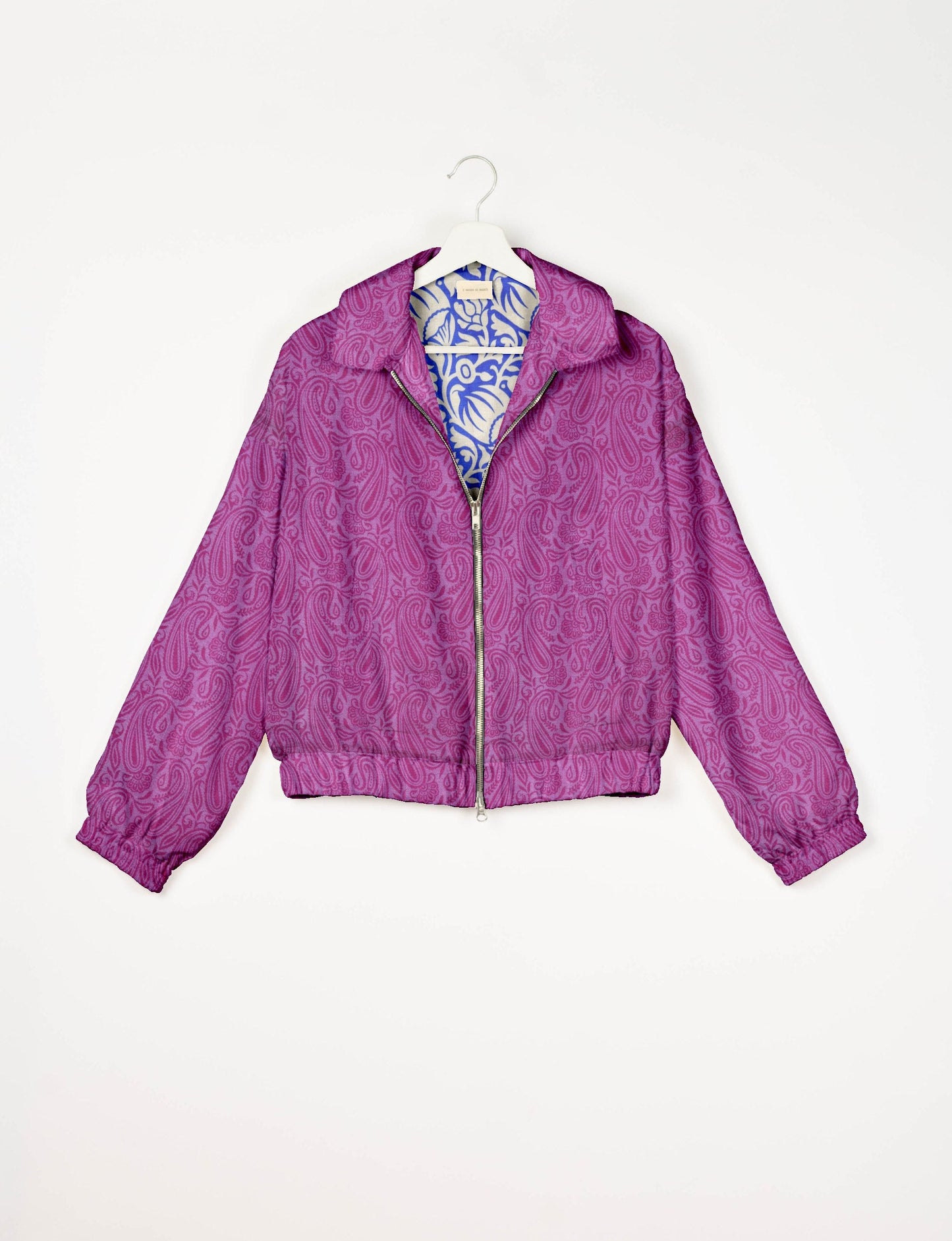 Upcycled Bomber Jacket made from recycled sari materials, featuring a cute cropped shape, elasticated hem and cuffs, and contrast sari print lining. Sustainable apparel promoting eco-friendly fashion and ethical clothing.