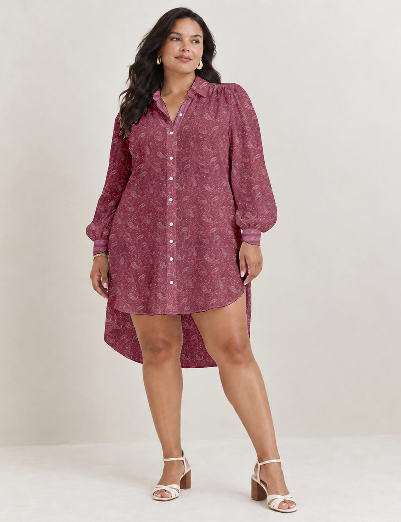 High low shirt with a relaxed fit, button-down front, classic collar, gathered shoulders and full-length blouson sleeves.