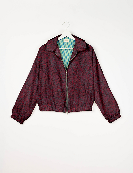 Upcycled Bomber Jacket made from recycled sari materials, featuring a cute cropped shape, elasticated hem and cuffs, and contrast sari print lining. Sustainable apparel promoting eco-friendly fashion and ethical clothing.