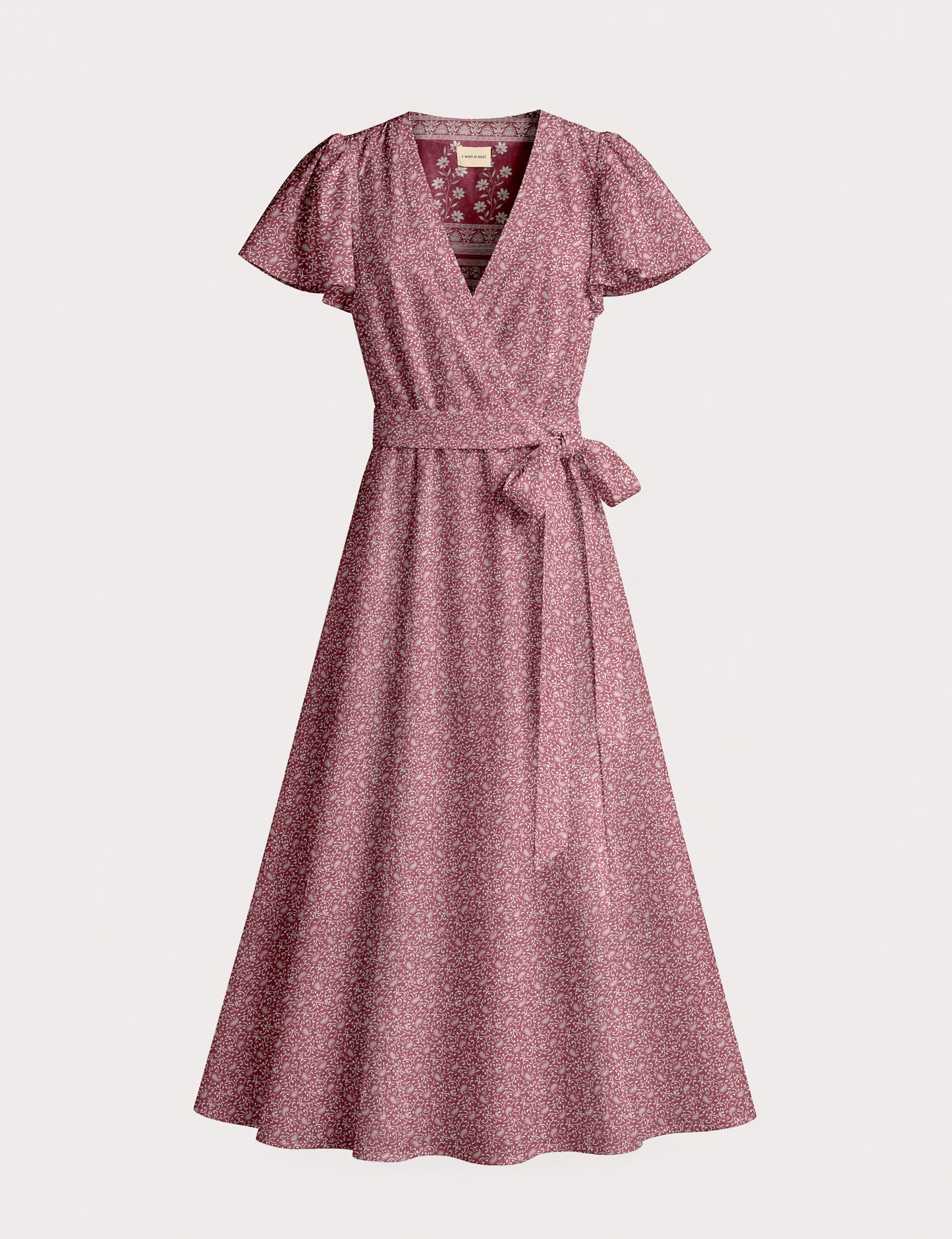 Elegant midi wrap dress with a V-neckline, adjustable waist tie, fitted bodice, and flared skirt for a timeless, flattering silhouette.