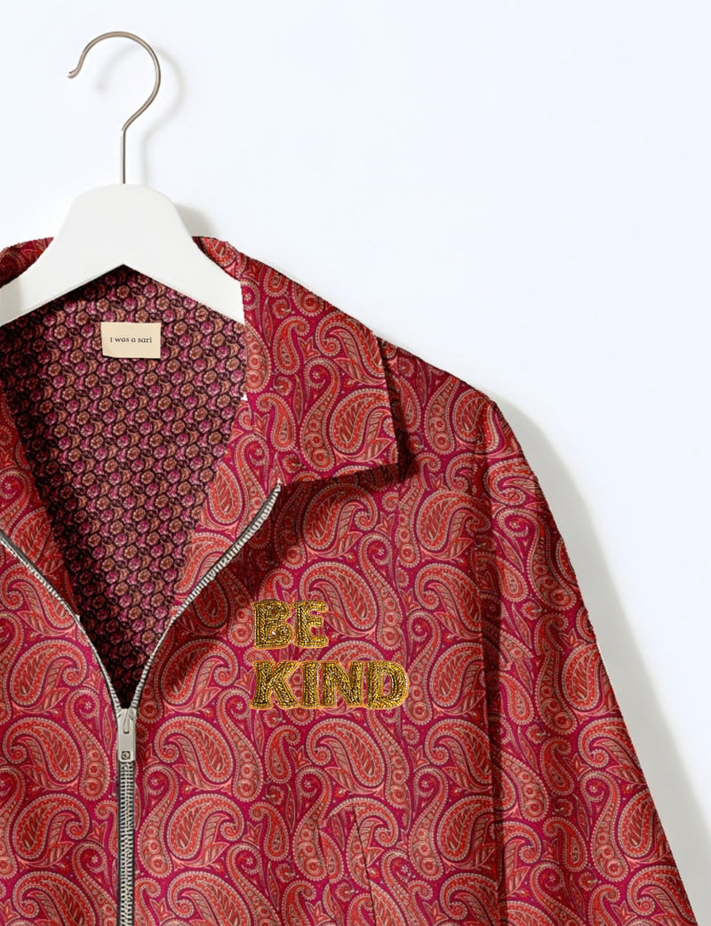 BE KIND Bomber jacket made from upcycled sari fabric with handcrafted Aari embroidery by female artisans.