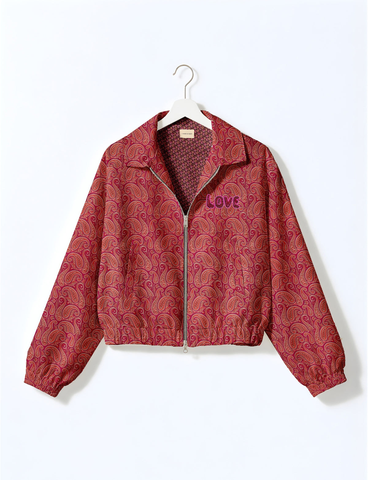 Love Bomber Jacket made from recycled fabric, featuring hand-stitched Aari embroidery. A unique piece of zero-waste clothing, part of the circular fashion movement. Designed with upcycled materials for a stylish yet environmentally friendly clothing choice.