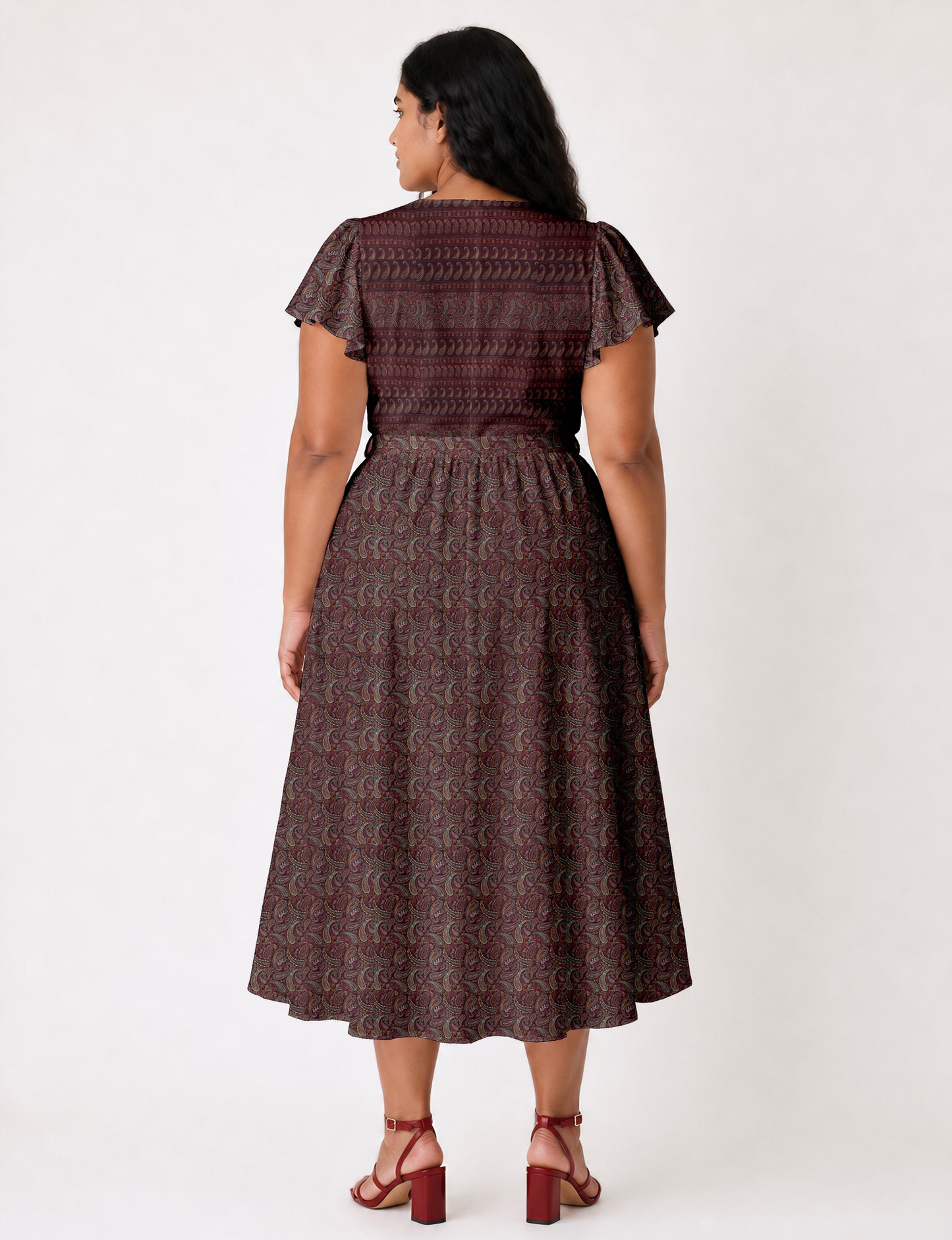 Elegant midi wrap dress with a V-neckline, adjustable waist tie, fitted bodice, and flared skirt for a timeless, flattering silhouette.