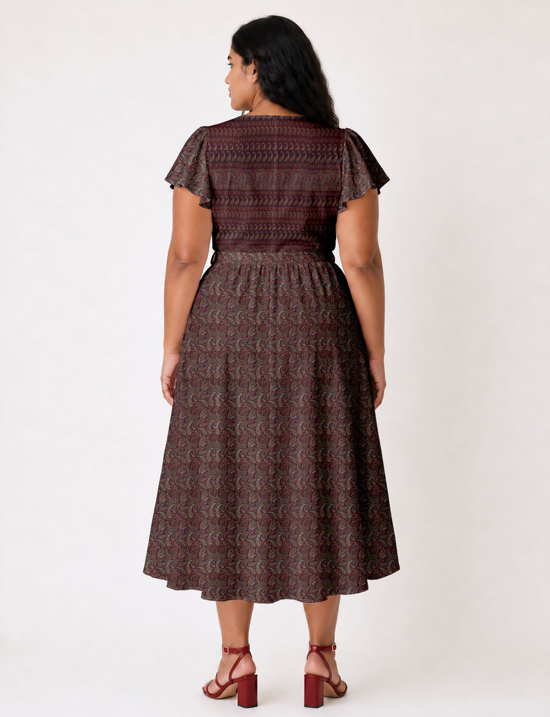 Elegant midi wrap dress with a V-neckline, adjustable waist tie, fitted bodice, and flared skirt for a timeless, flattering silhouette.