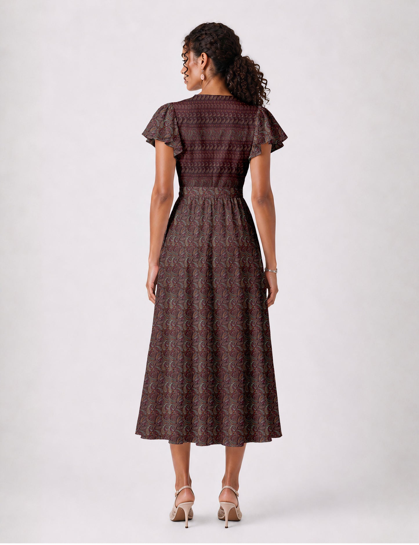 Elegant midi wrap dress with a V-neckline, adjustable waist tie, fitted bodice, and flared skirt for a timeless, flattering silhouette.
