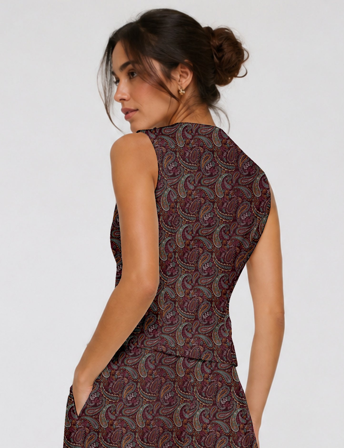 Women's fitted waistcoat with V-neck, single-breasted button closure, tailored silhouette, and pointed hem in sustainable fashion.