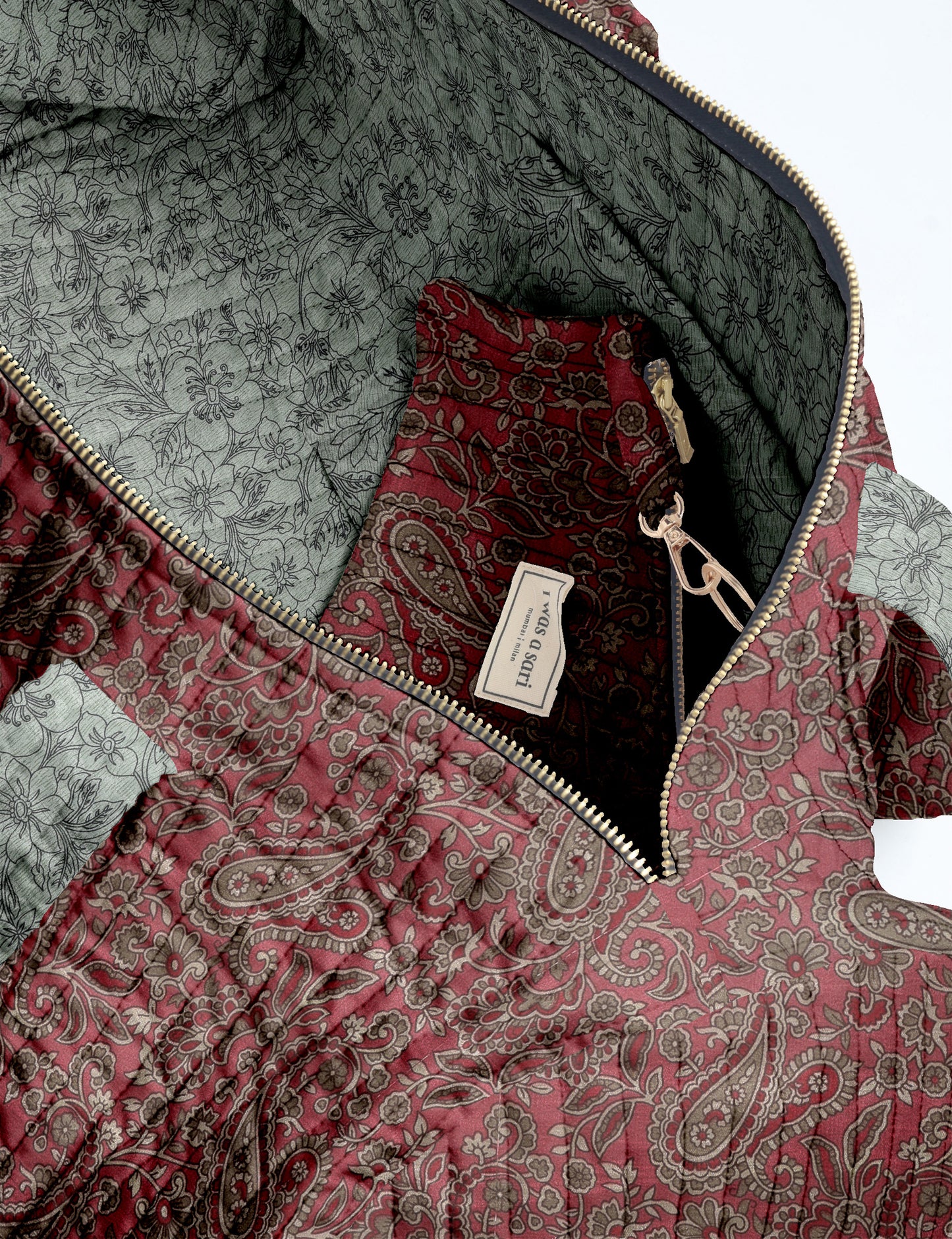 Brown paisley quilted bowling bag with dual handles, front zipper pocket, and "I was a sari" label on front side