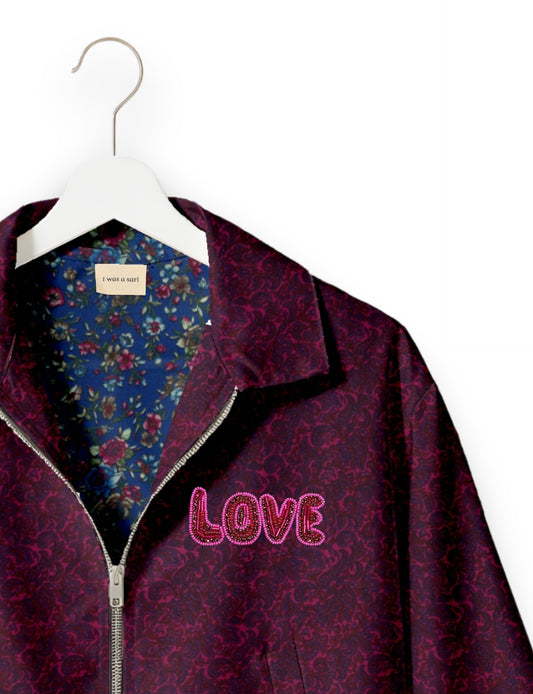 Love Bomber Jacket made from recycled fabric, featuring hand-stitched Aari embroidery. A unique piece of zero-waste clothing, part of the circular fashion movement. Designed with upcycled materials for a stylish yet environmentally friendly clothing choice.