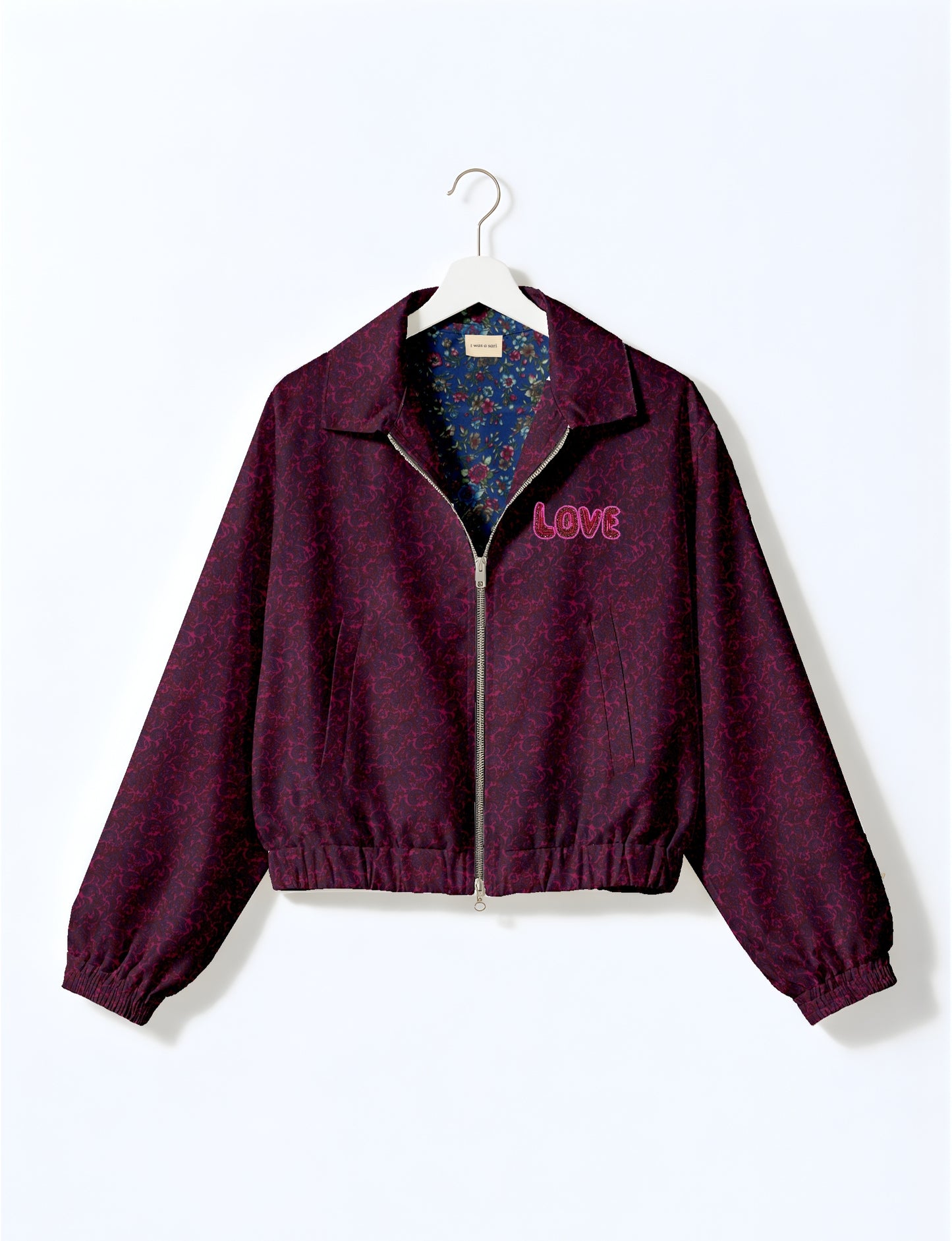Love Bomber Jacket made from recycled fabric, featuring hand-stitched Aari embroidery. A unique piece of zero-waste clothing, part of the circular fashion movement. Designed with upcycled materials for a stylish yet environmentally friendly clothing choice.
