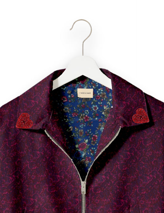 Make a bold statement with our Heart Drop Earrings, a symbol of conscious luxury and ethical fashion. Handcrafted using the intricate Aari embroidery technique, these earrings are made from upcycled sari fabric, embracing slow fashion and zero waste clothing. Elevate your look with sustainable apparel that supports fair trade fashion while reducing textile waste. Choose eco-friendly fashion that speaks of love, artistry, and responsibility.