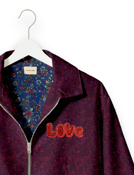Love Bomber Jacket made from recycled fabric, featuring hand-stitched Aari embroidery. A unique piece of zero-waste clothing, part of the circular fashion movement. Designed with upcycled materials for a stylish yet environmentally friendly clothing choice.