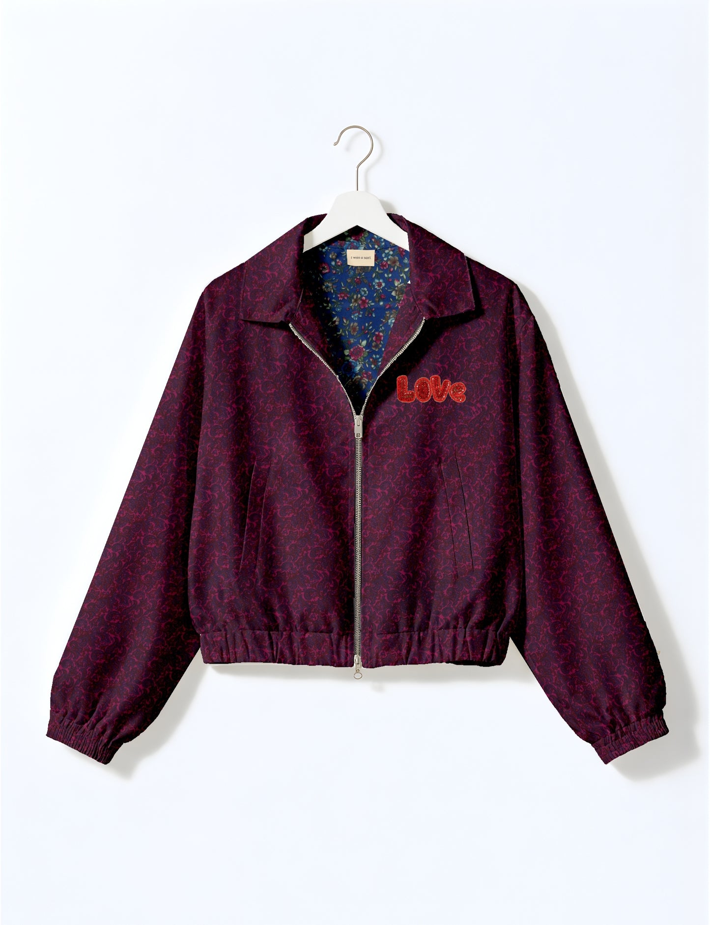 Love Bomber Jacket made from recycled fabric, featuring hand-stitched Aari embroidery. A unique piece of zero-waste clothing, part of the circular fashion movement. Designed with upcycled materials for a stylish yet environmentally friendly clothing choice.