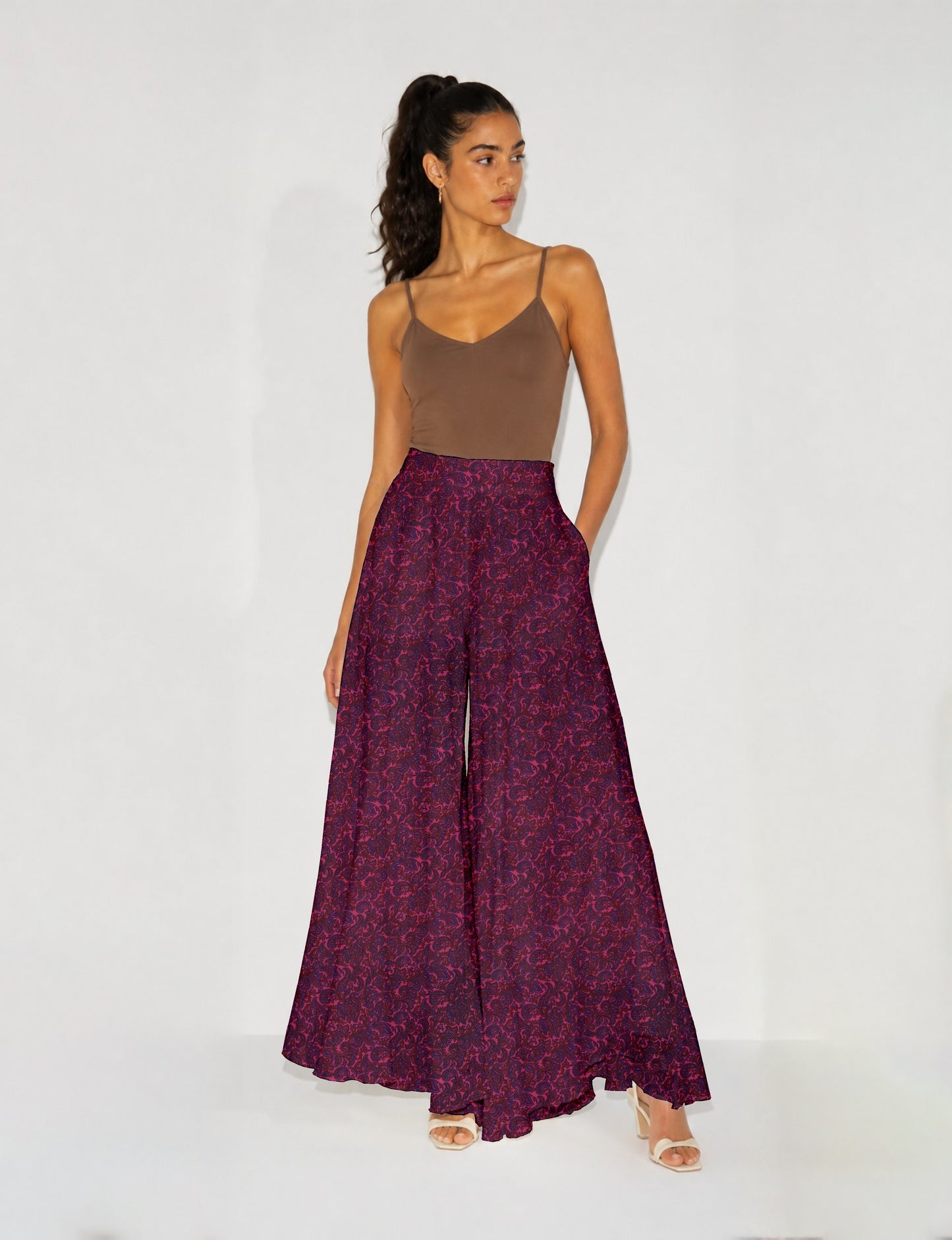Women's wide leg palazzo trousers with a fitted waistband and relaxed flowing silhouette.