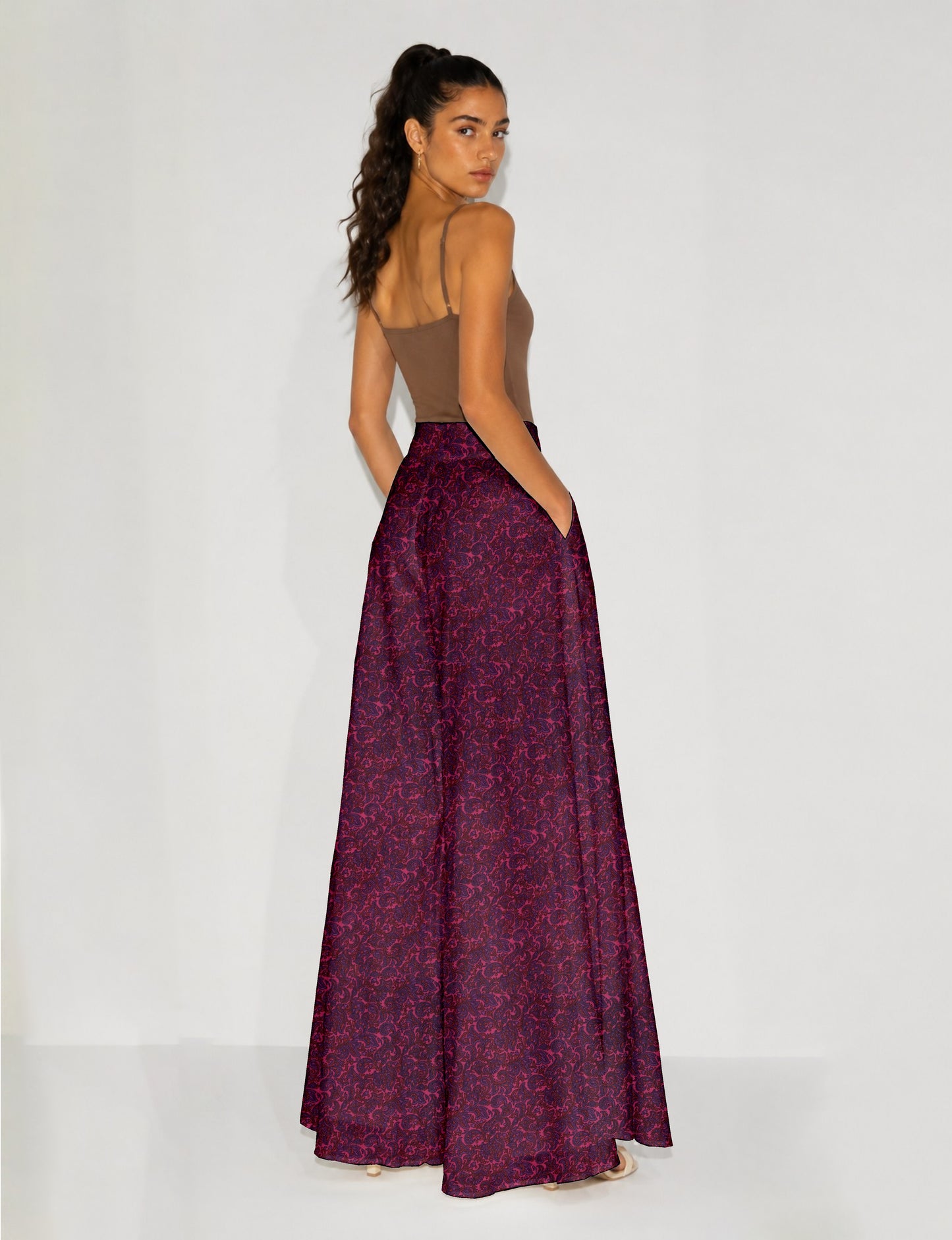 Women's wide leg palazzo trousers with a fitted waistband and relaxed flowing silhouette.