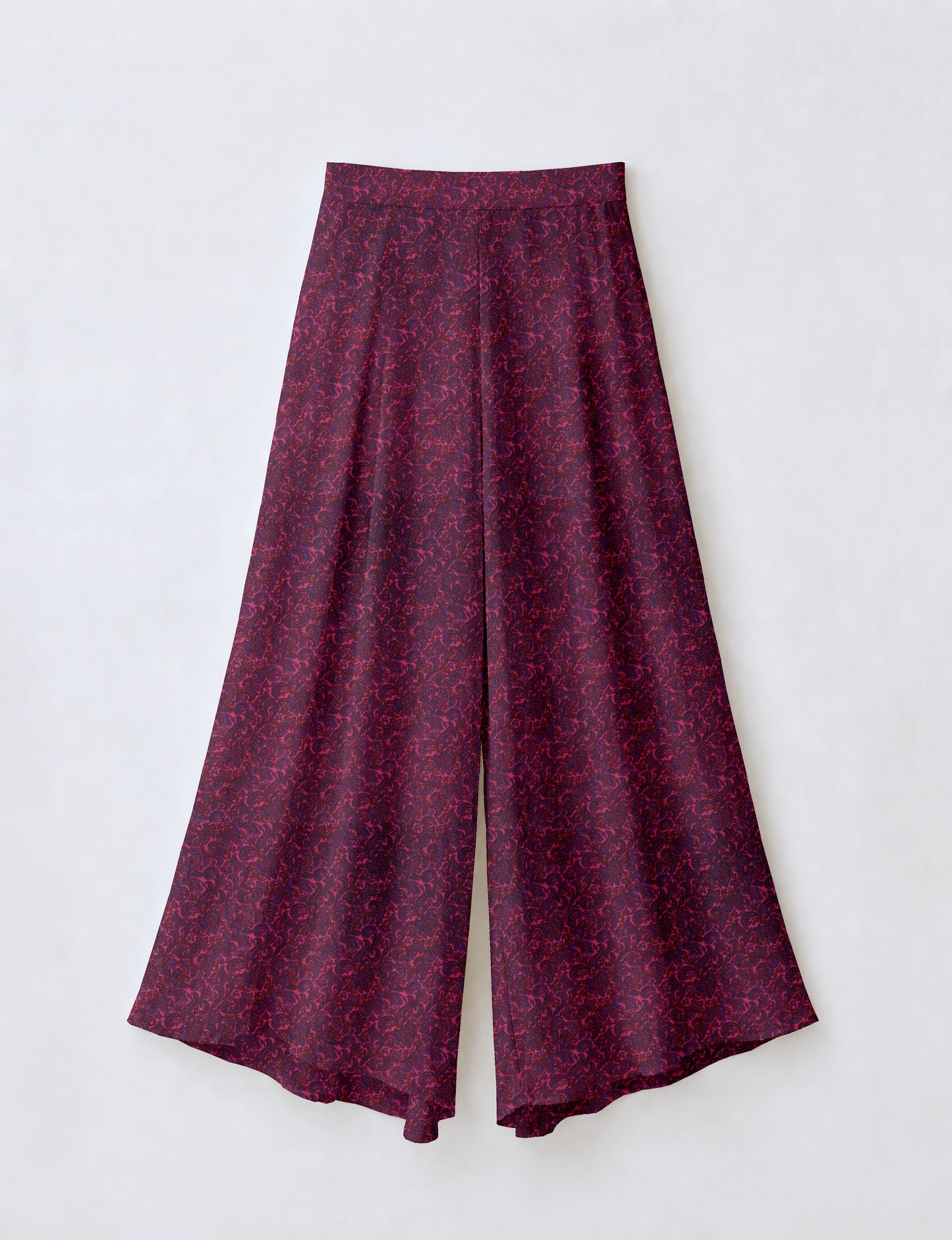 Women's wide leg palazzo trousers with a fitted waistband and relaxed flowing silhouette.