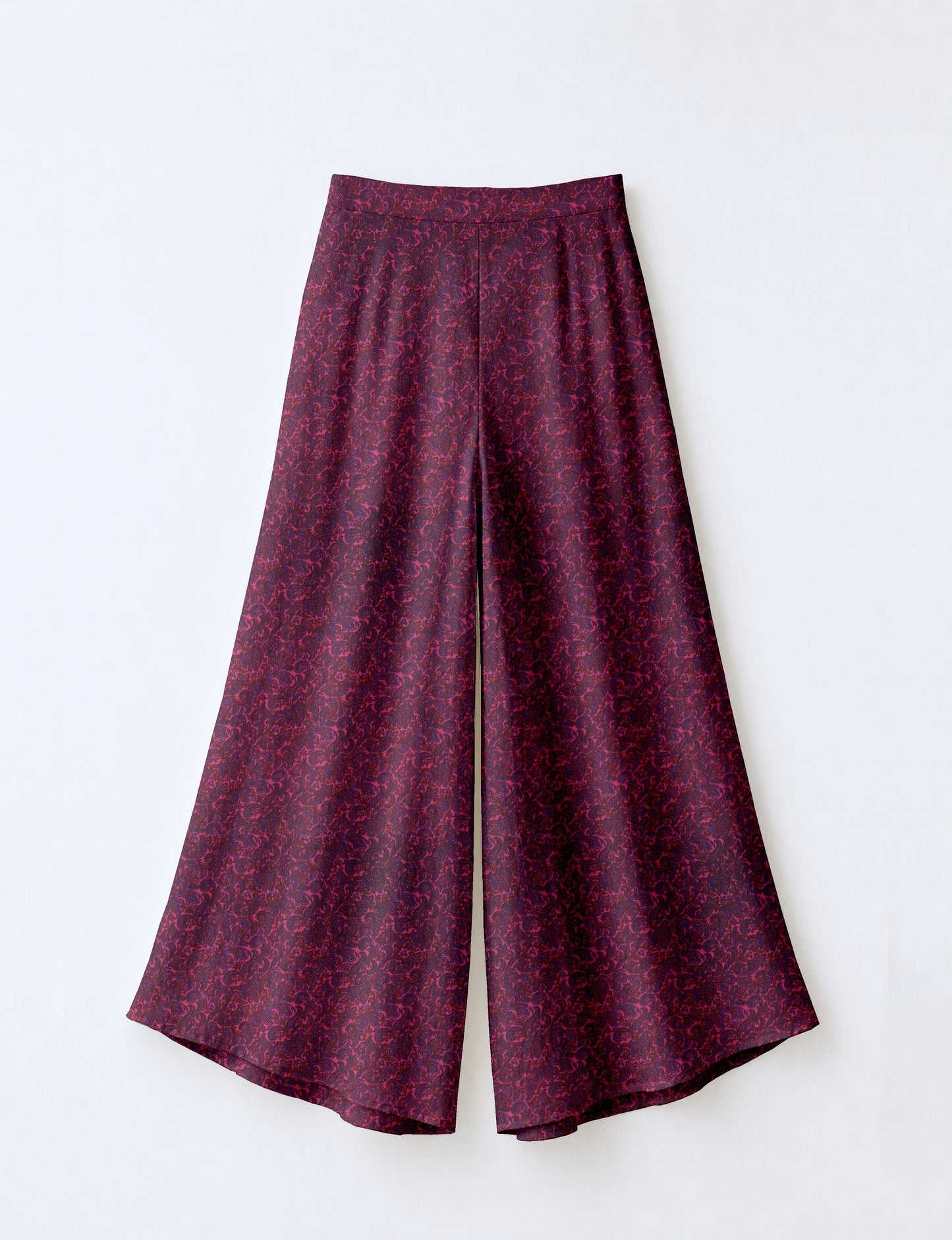 Women's wide leg palazzo trousers with a fitted waistband and relaxed flowing silhouette.