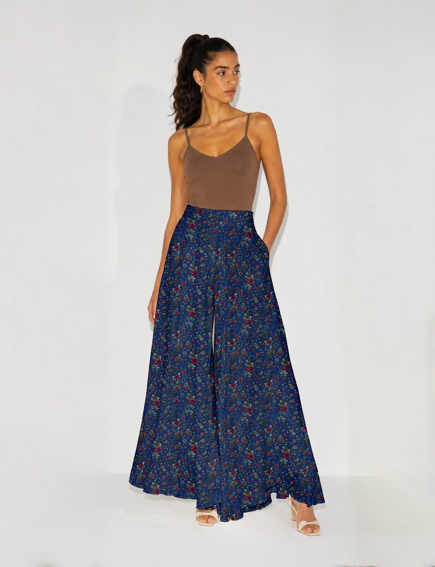 Women's wide leg palazzo trousers with a fitted waistband and relaxed flowing silhouette.